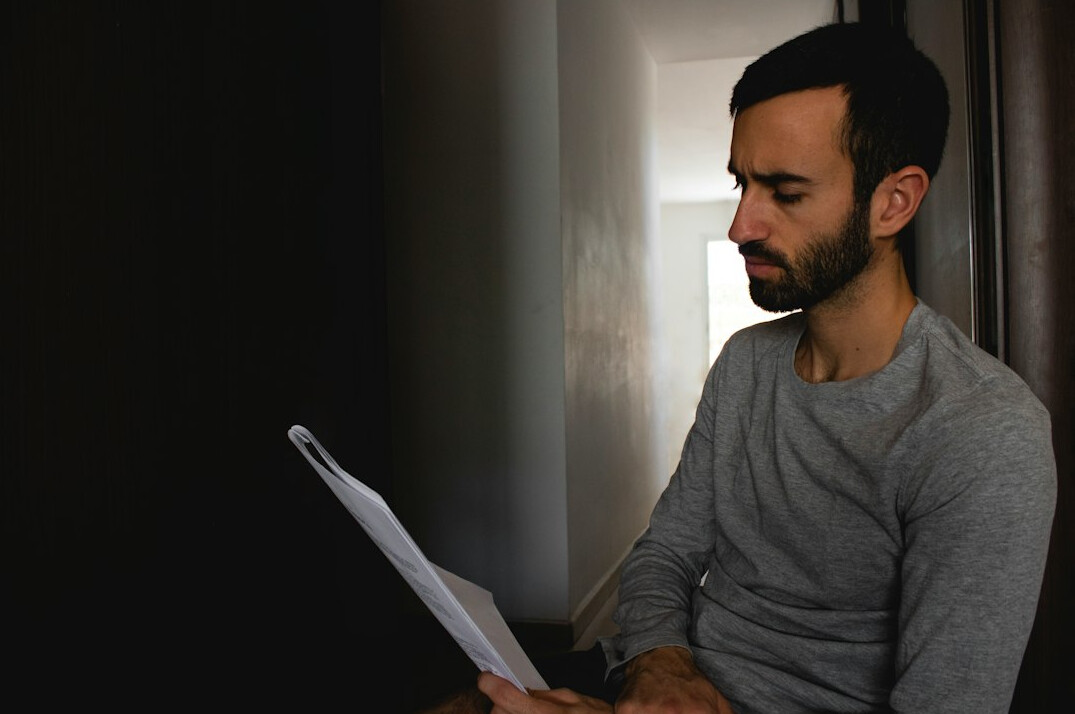 person reviewing debt papers