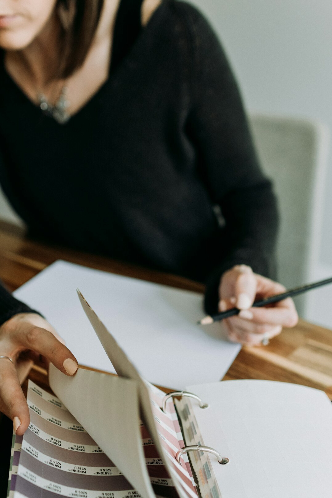 woman writing budget notes