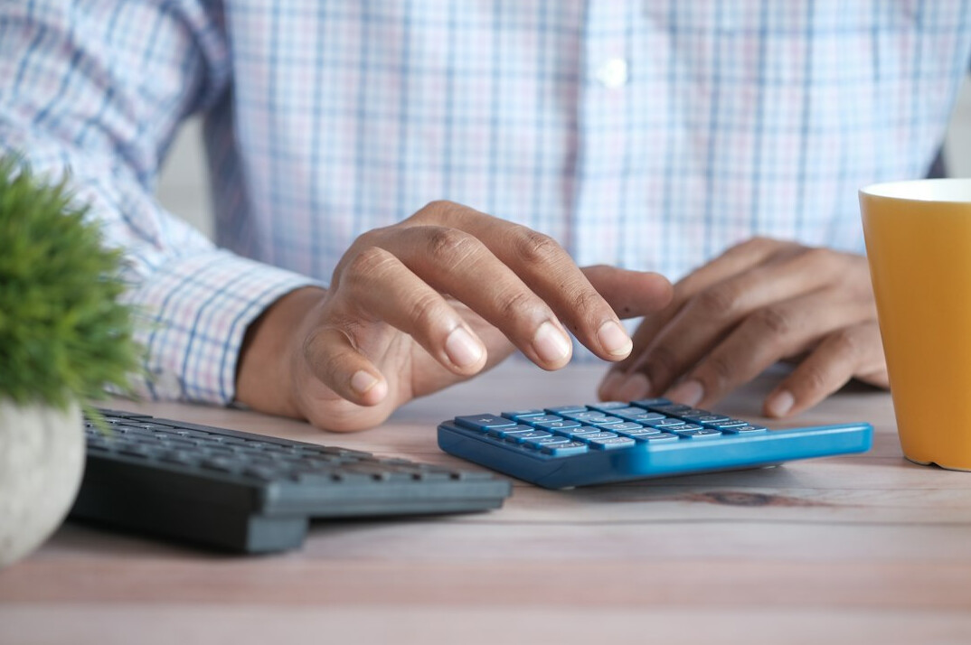 woman using financial calculator