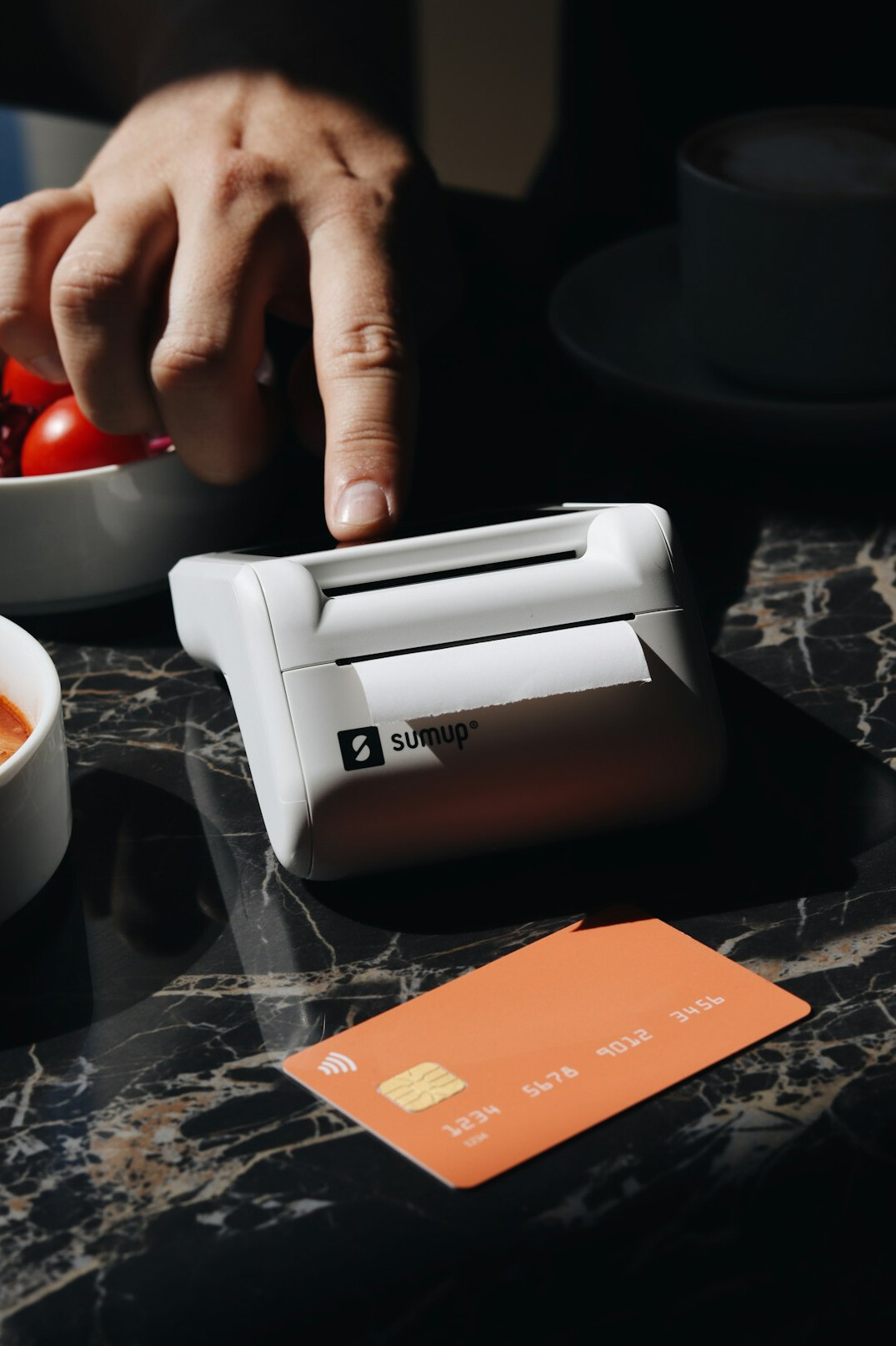 person cutting credit card